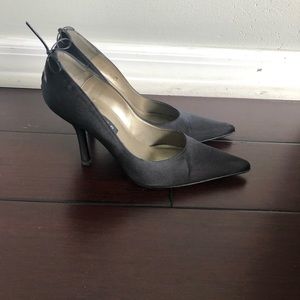 Black satin pumps